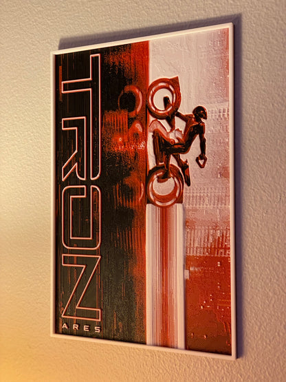 Decorative wall art with 'TRON' design on a textured beige background