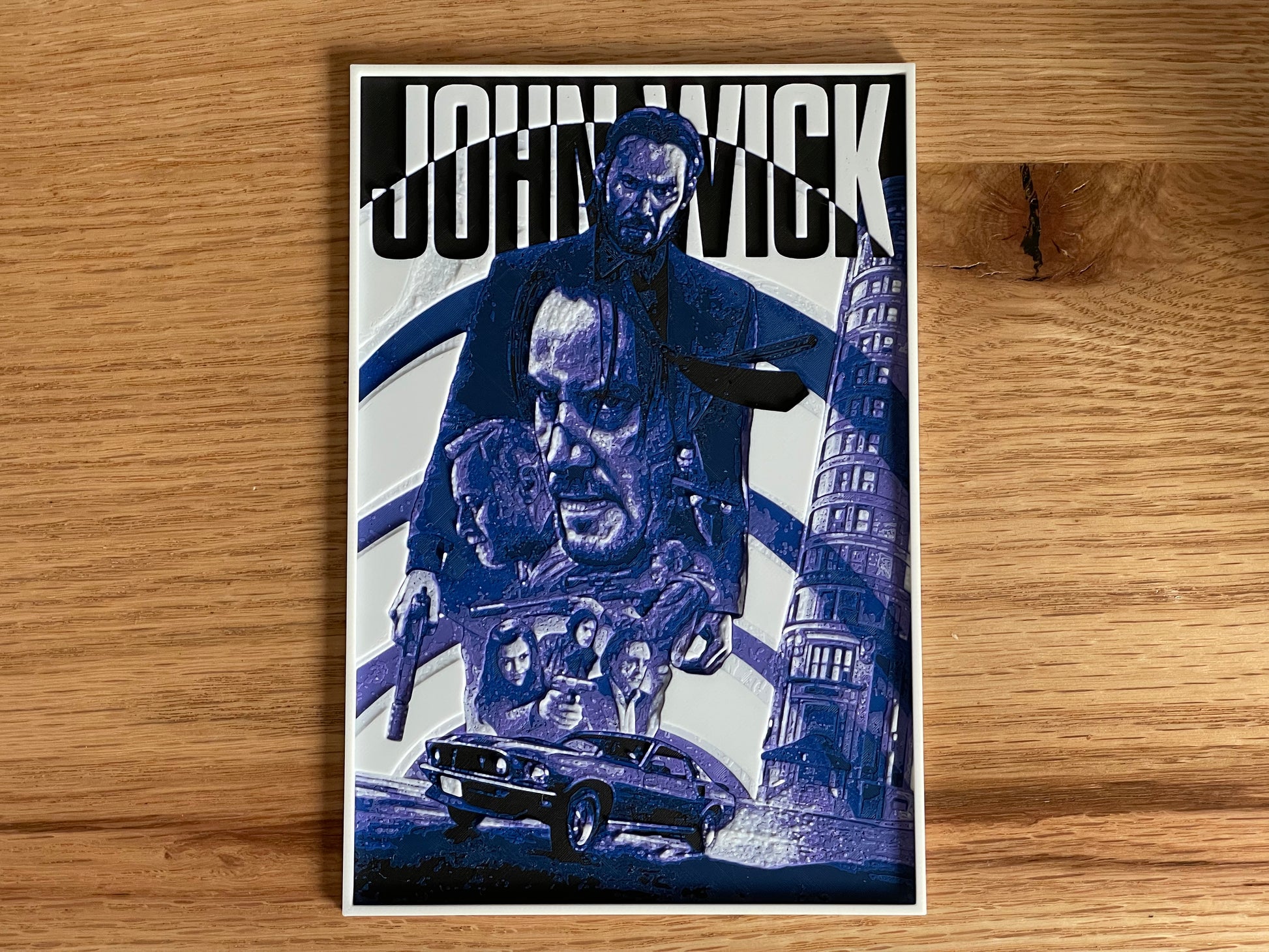Movie poster for 'John Wick' on a wooden surface