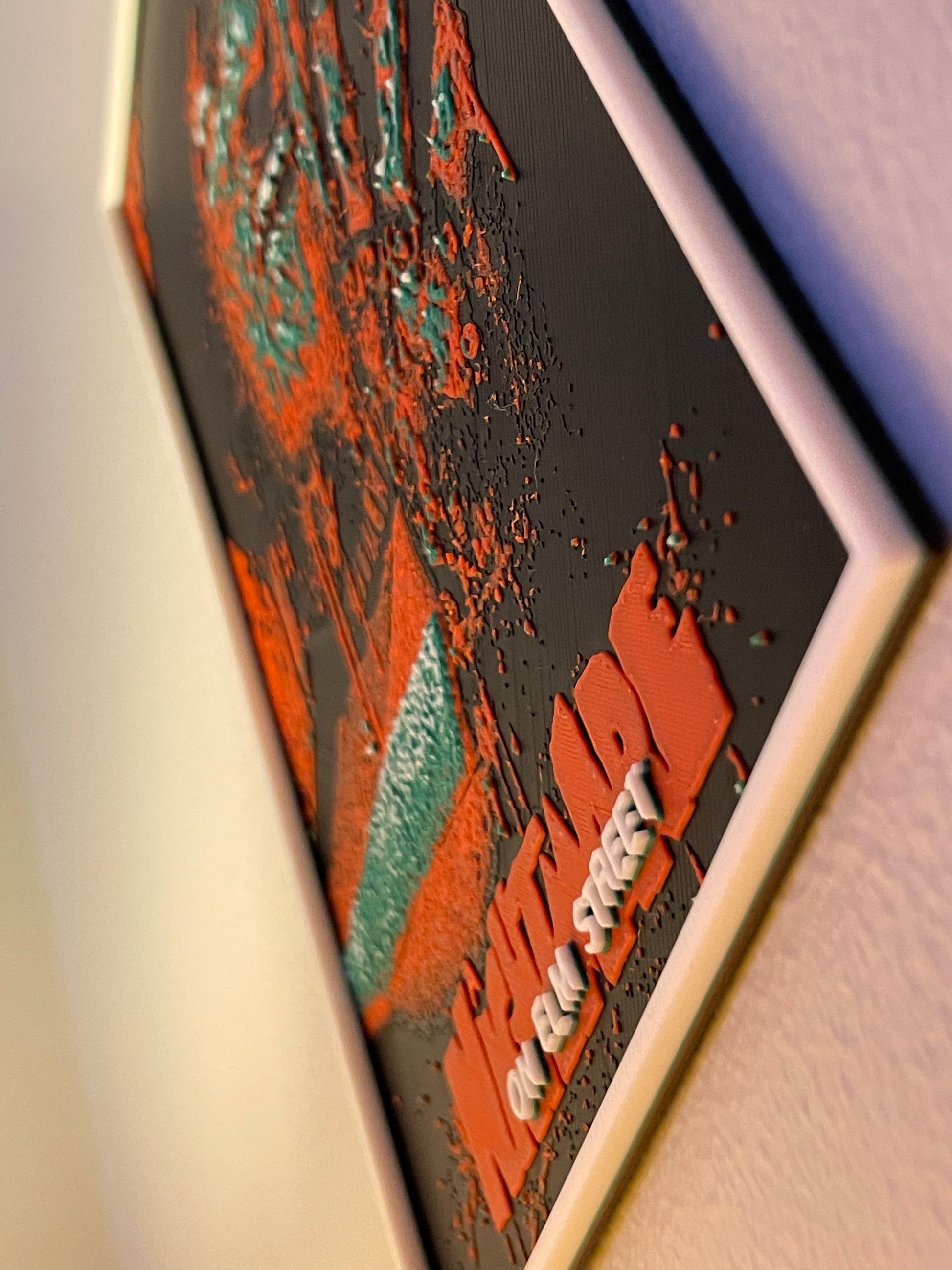 Close-up of a textured surface with red and green patterns and 'freddy' branding.