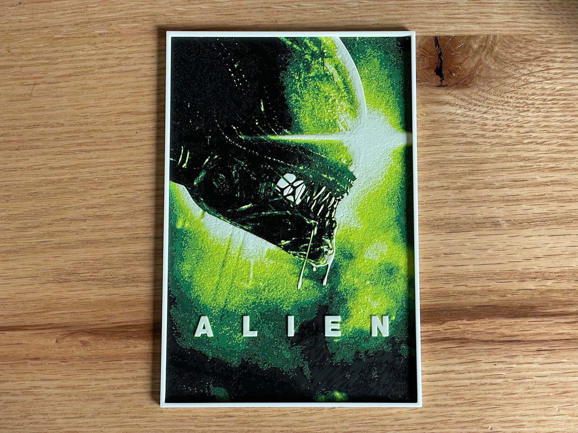 Alien movie poster on a wooden surface