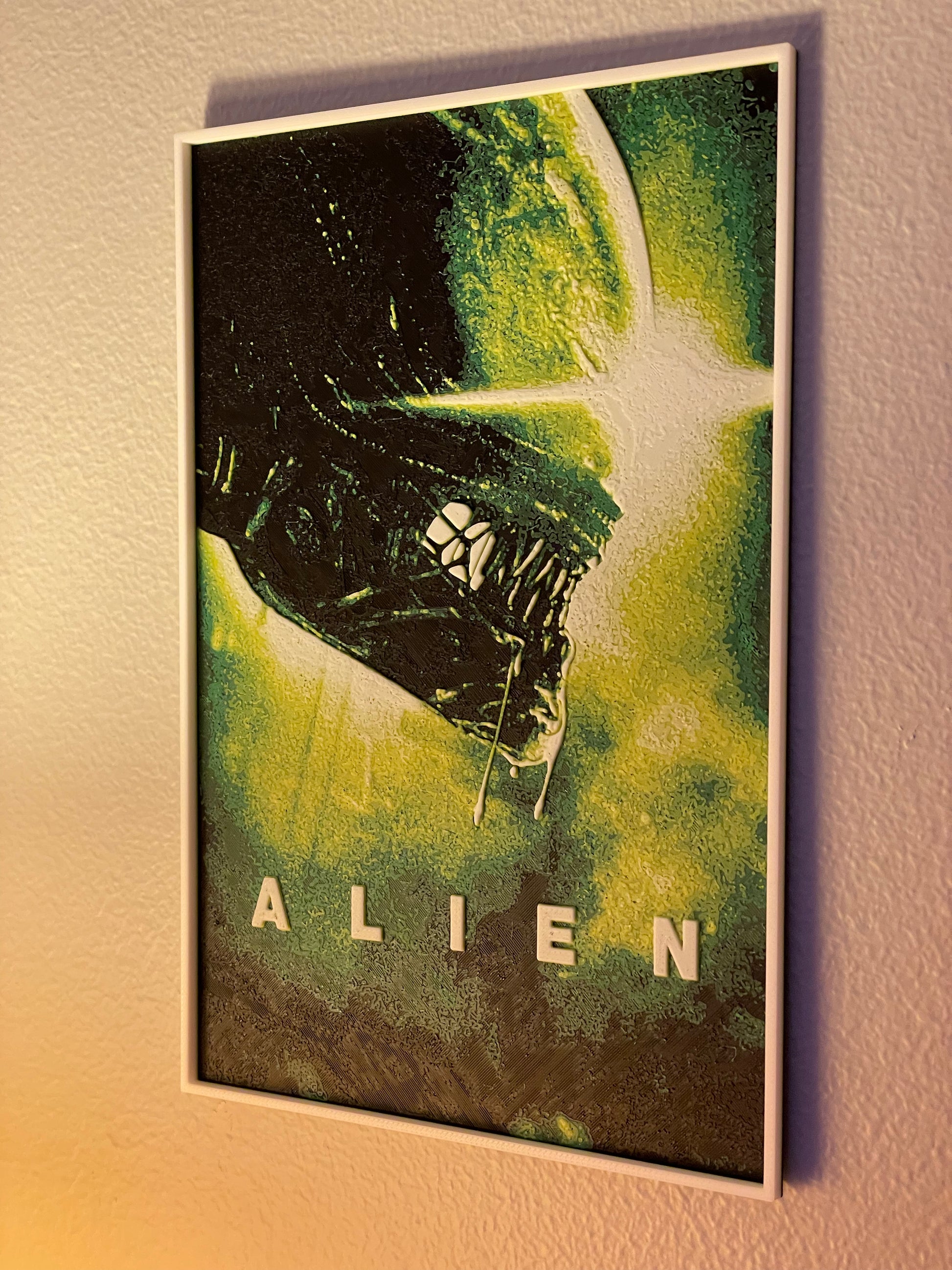 Framed 'Alien' movie poster on a wall