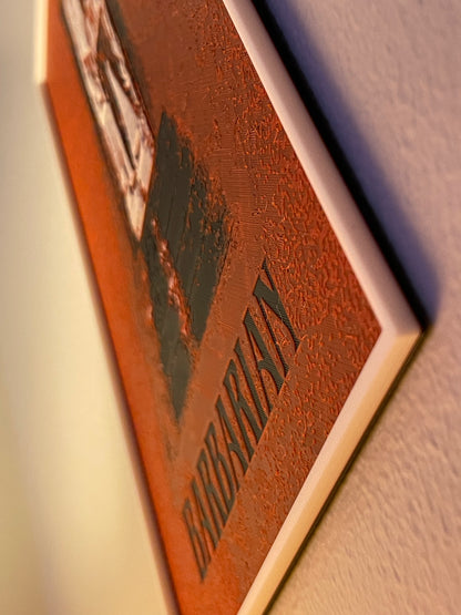 Close-up of a poster with 'barbarian' embossed on it.