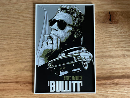 Poster of a movie with a stylized portrait and car on a wooden surface