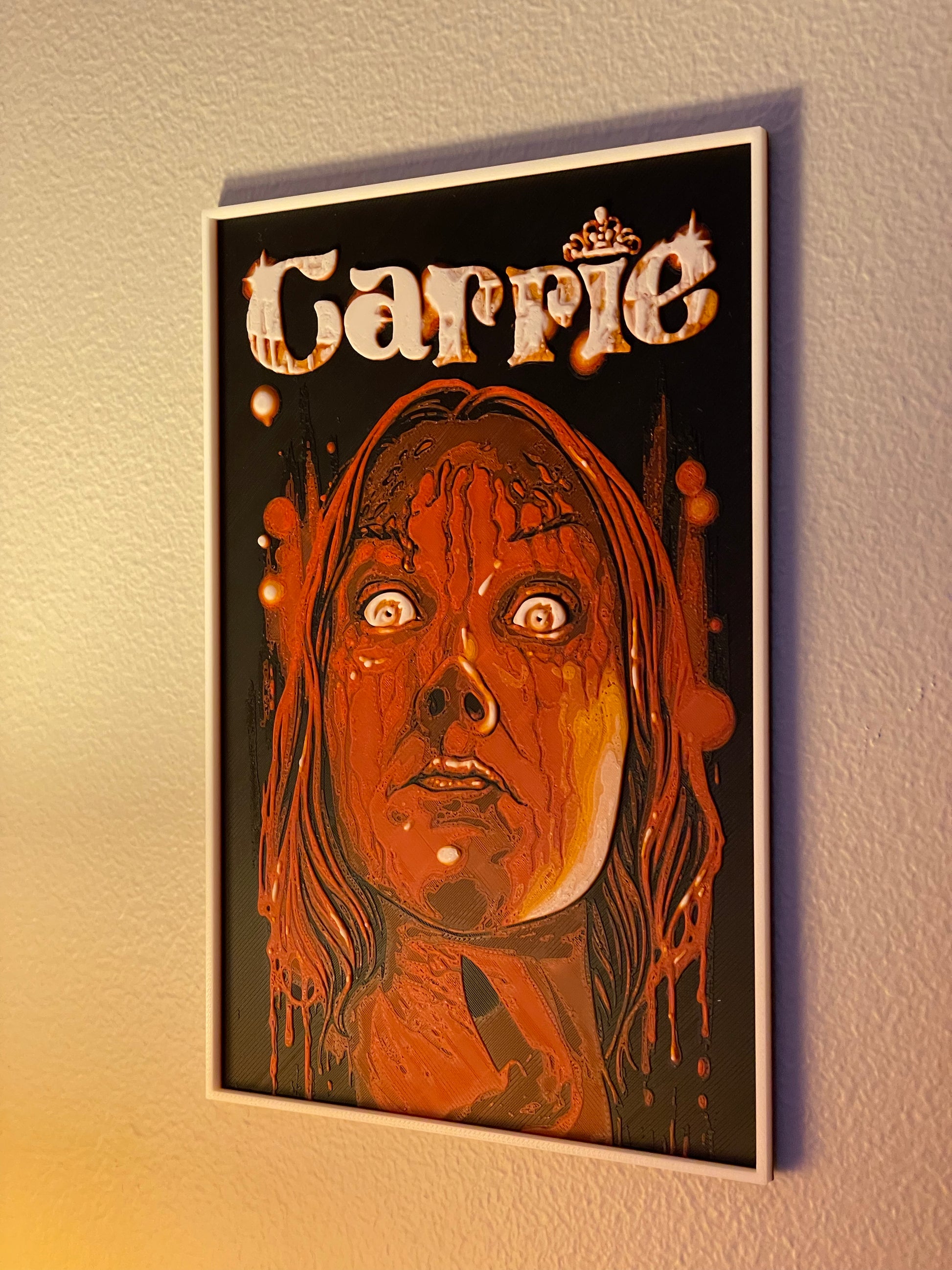 Poster of 'Carrie' with a stylized illustration of a woman's face on a dark background.
