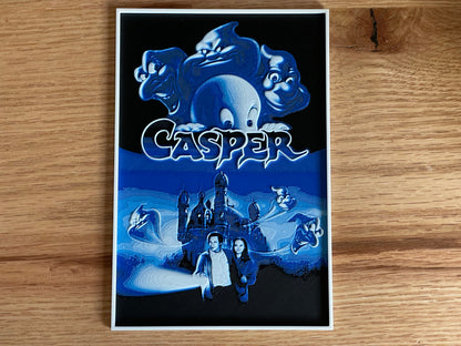 Casper movie poster on a wooden surface