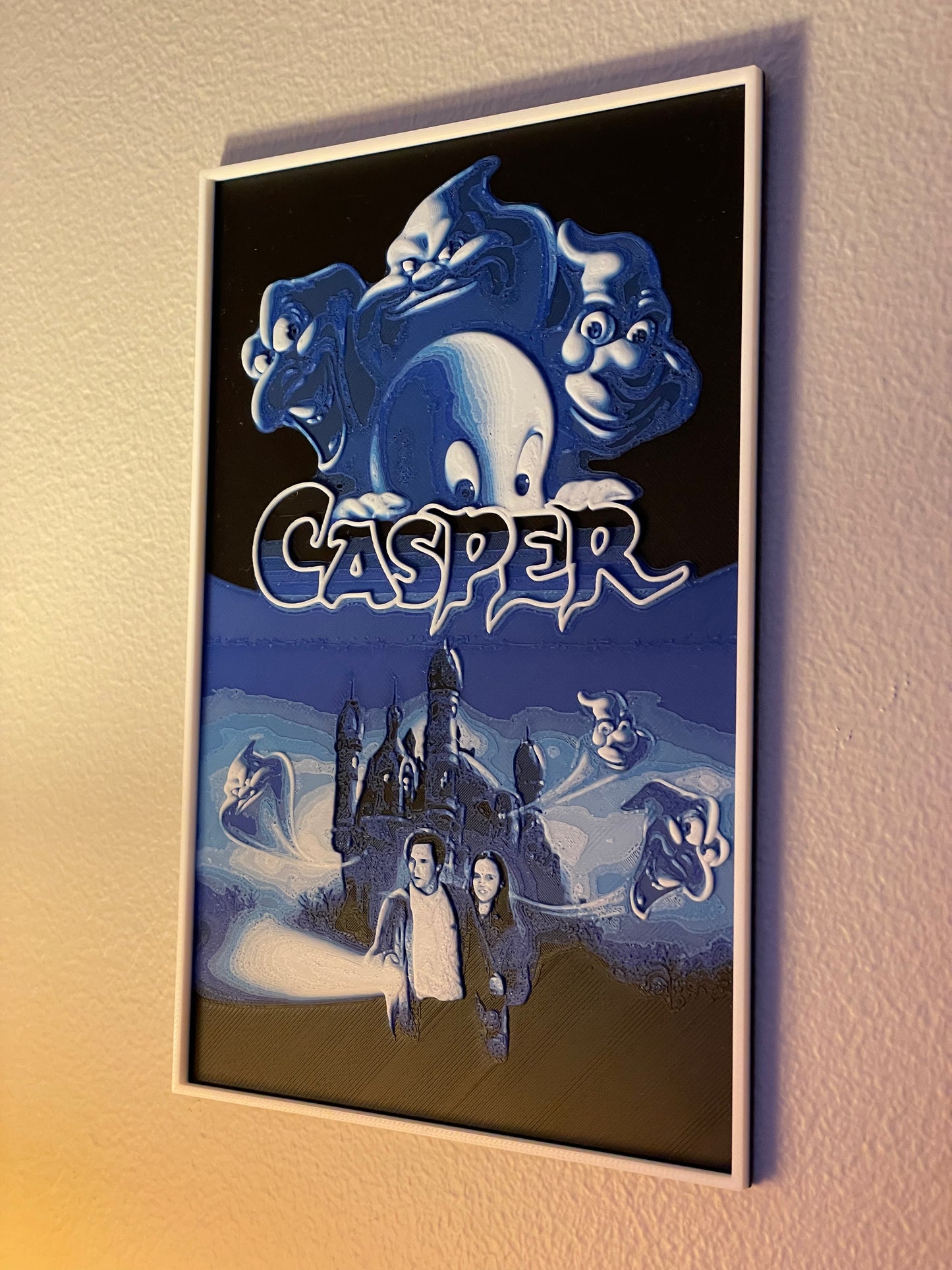 Framed poster of Casper the Friendly Ghost with a castle and characters on a dark background.
