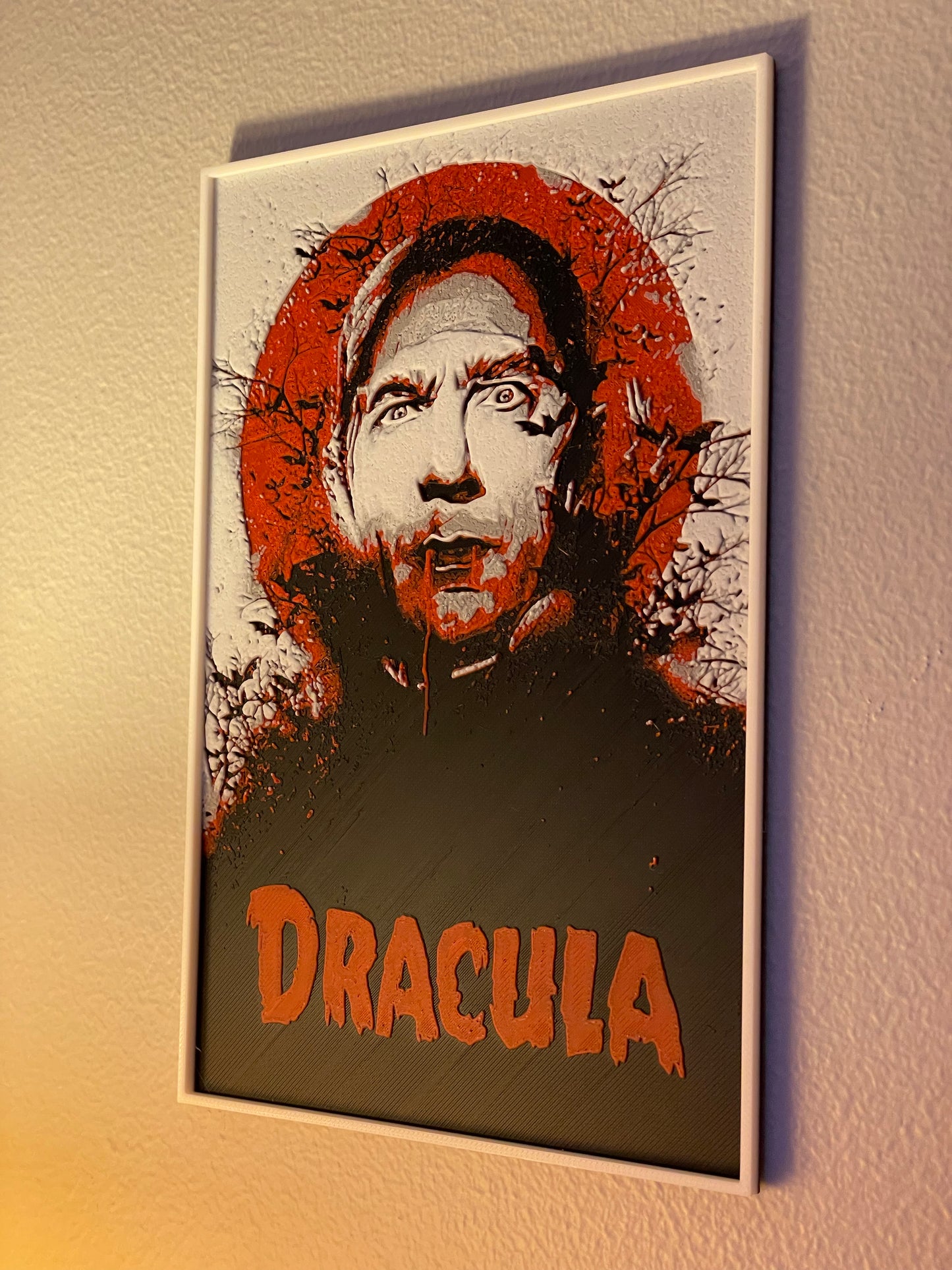 Poster of a character with 'Dracula' text on a textured wall.