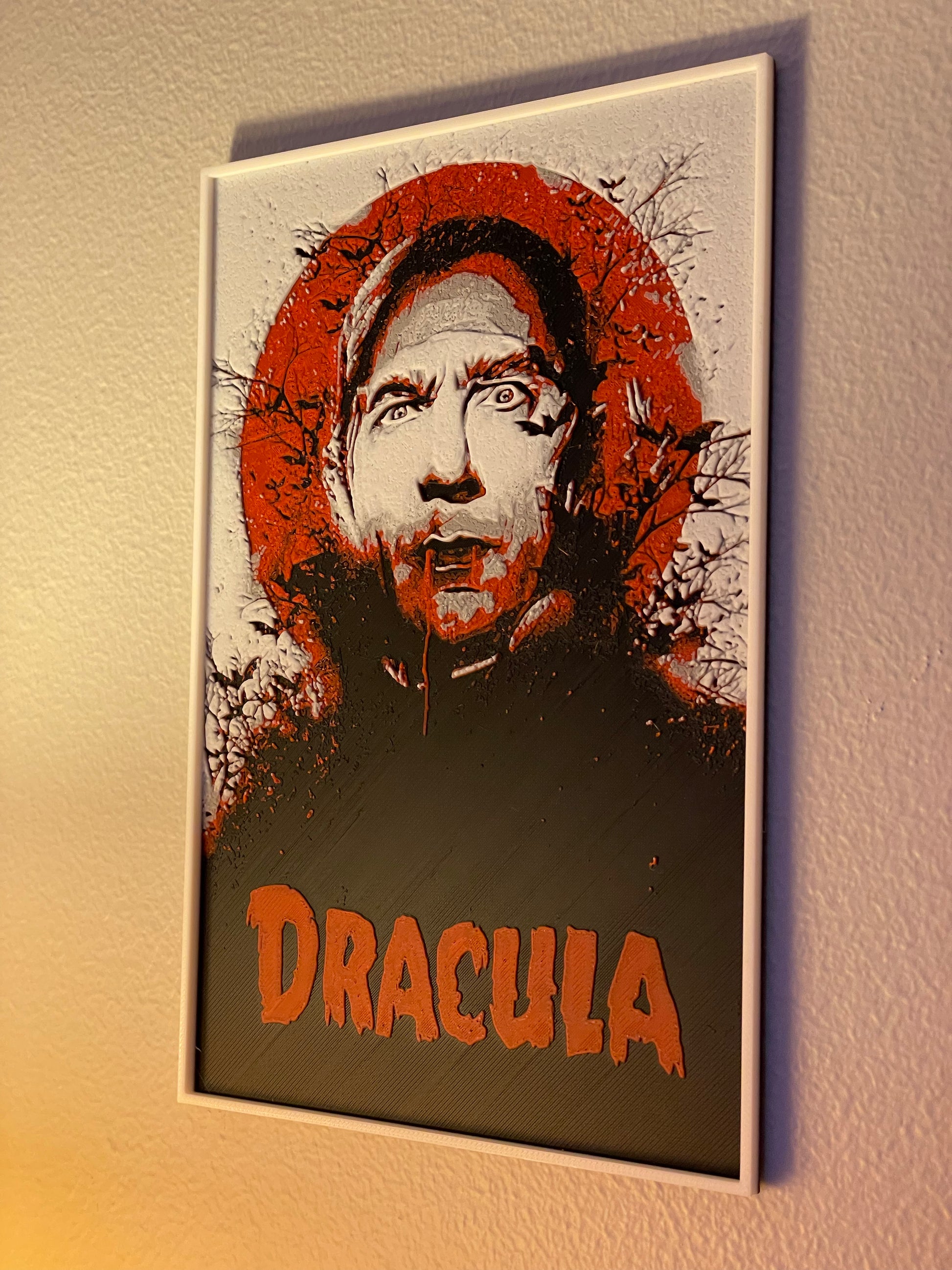 Poster of a character with 'Dracula' text on a textured wall.