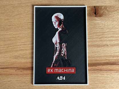 Movie poster for 'ex machina' on a wooden surface