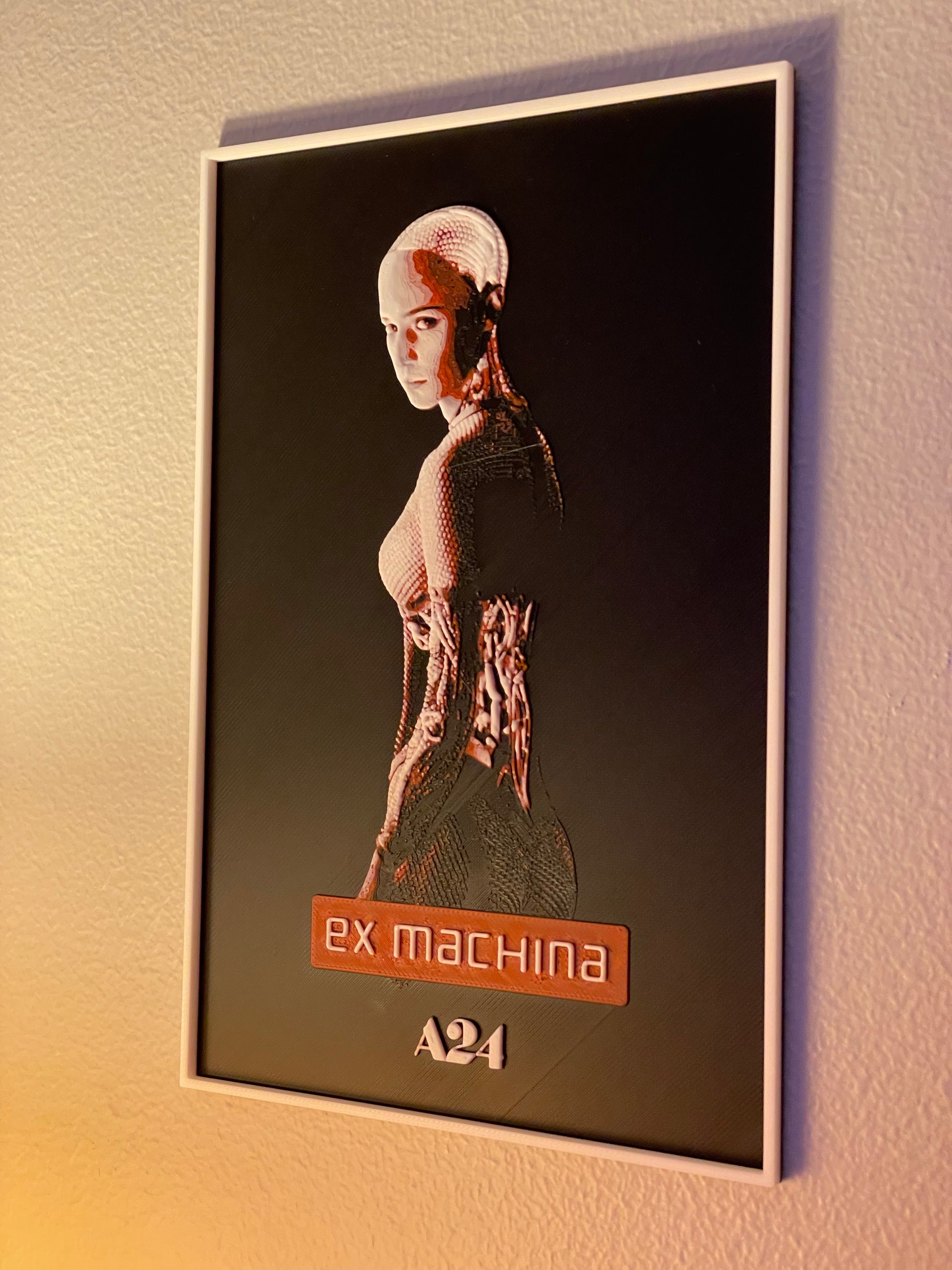 Movie poster for 'ex machina' with a stylized woman's face on a dark background.