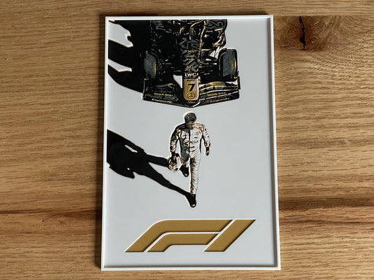 F1-themed collectible card with driver illustration on a wooden surface