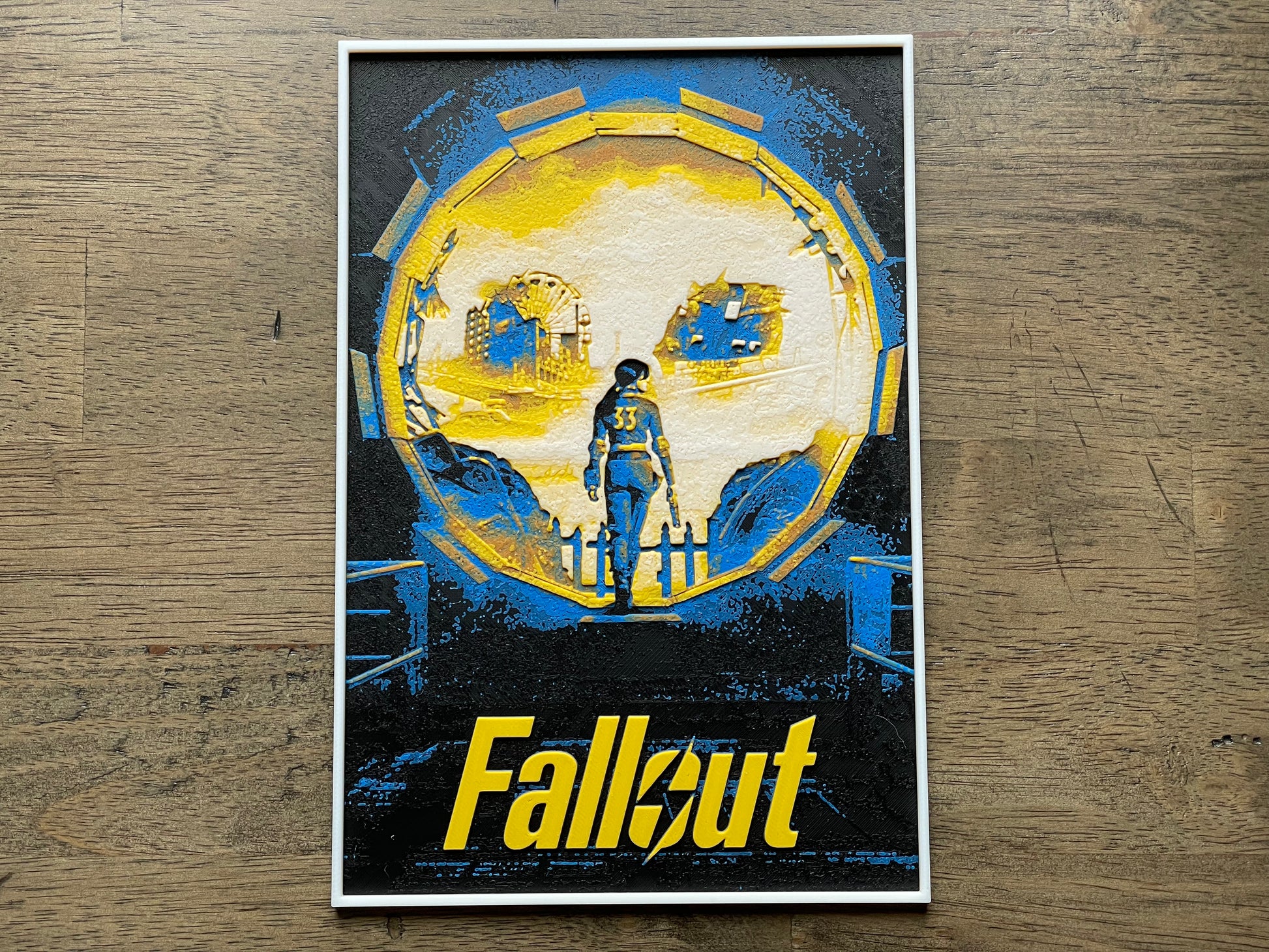 Poster of a character from 'Fallout' show on a wooden surface