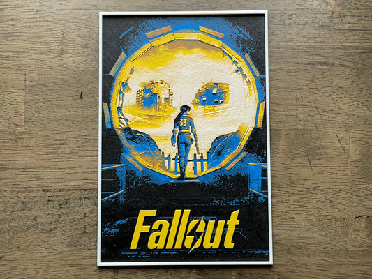Poster of a character from 'Fallout' show on a wooden surface