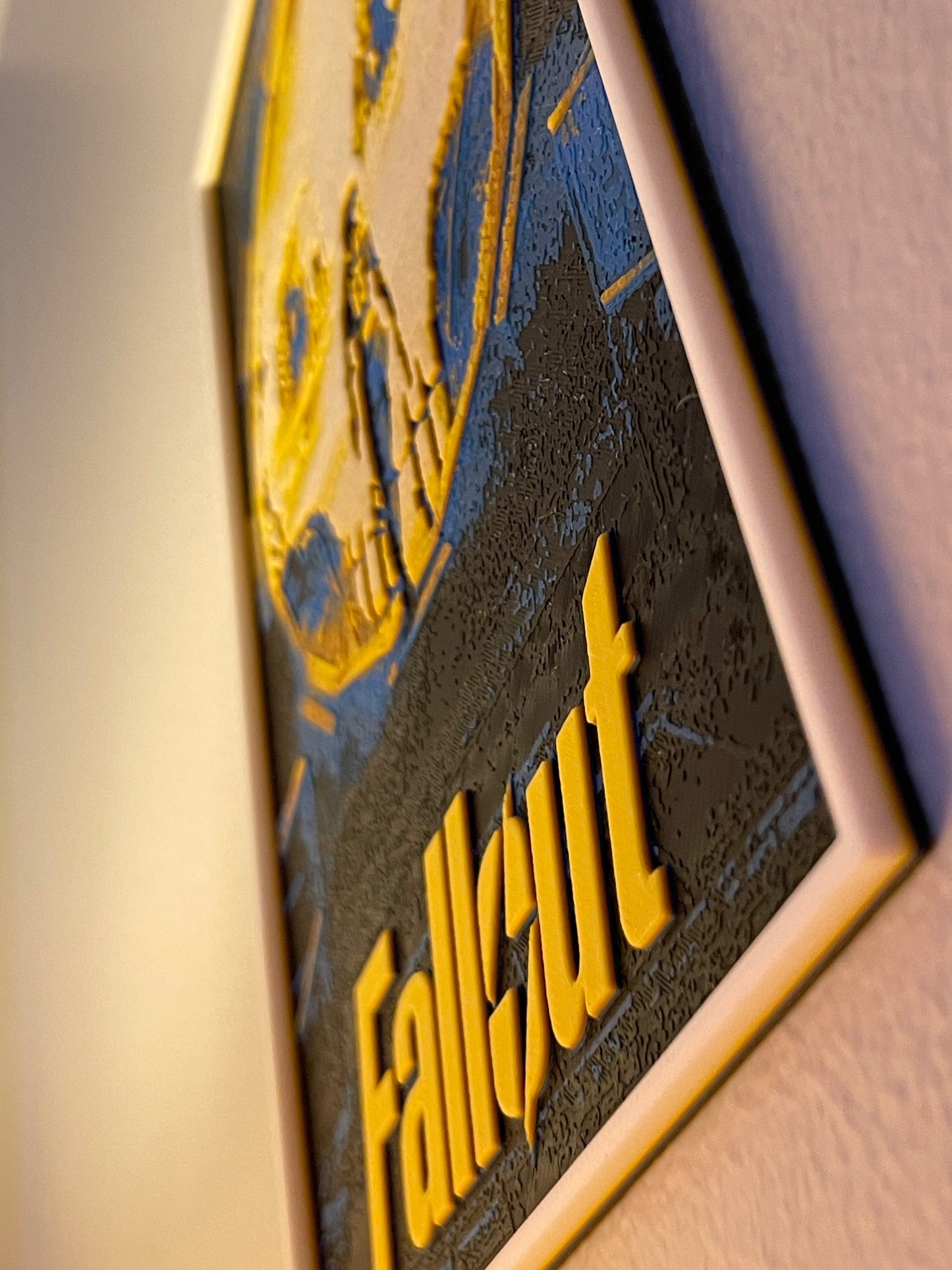 Close-up of a 'Fallout' logo on a textured surface