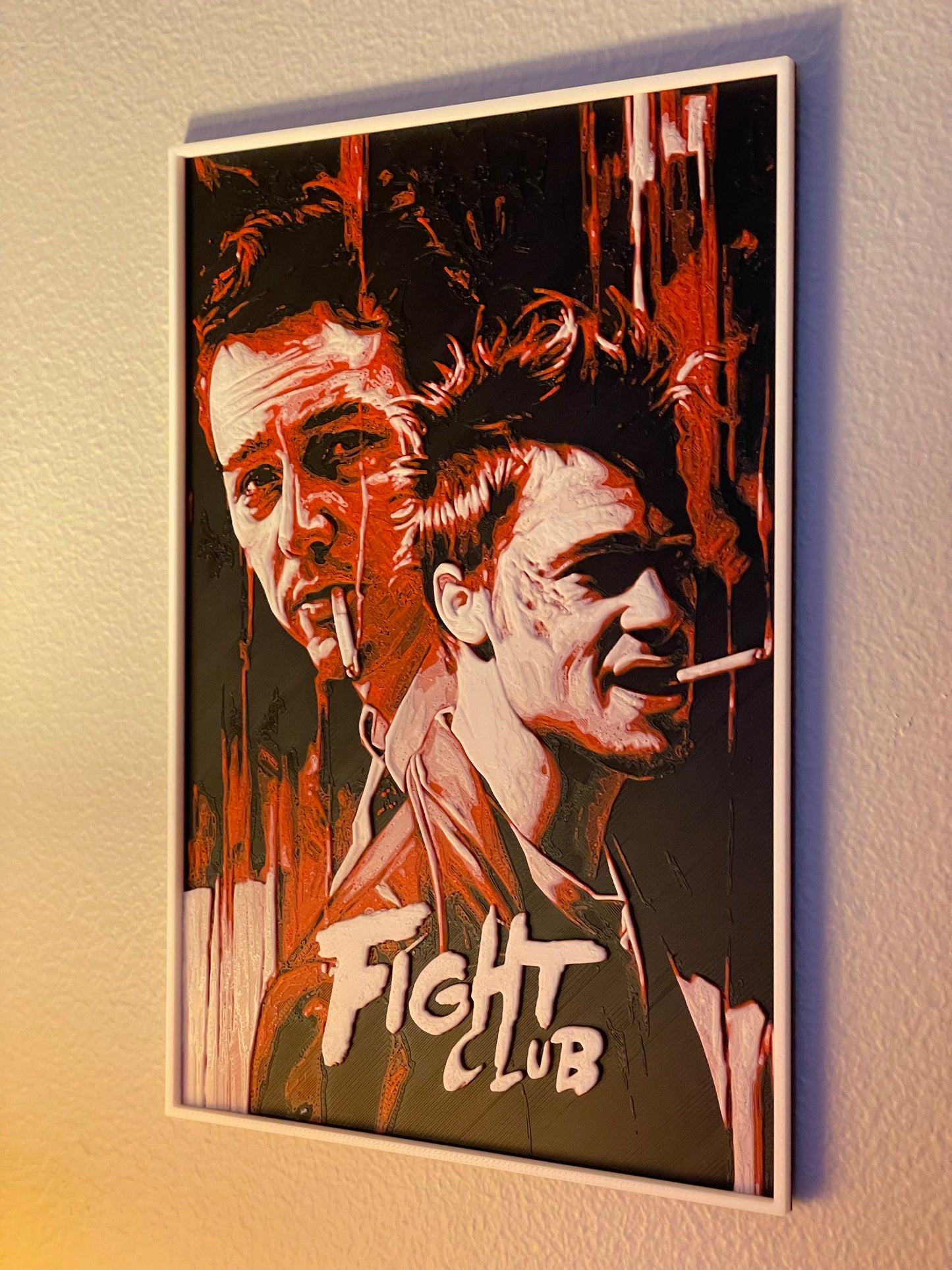 Framed poster of 'Fight Club' with two faces and the movie title.