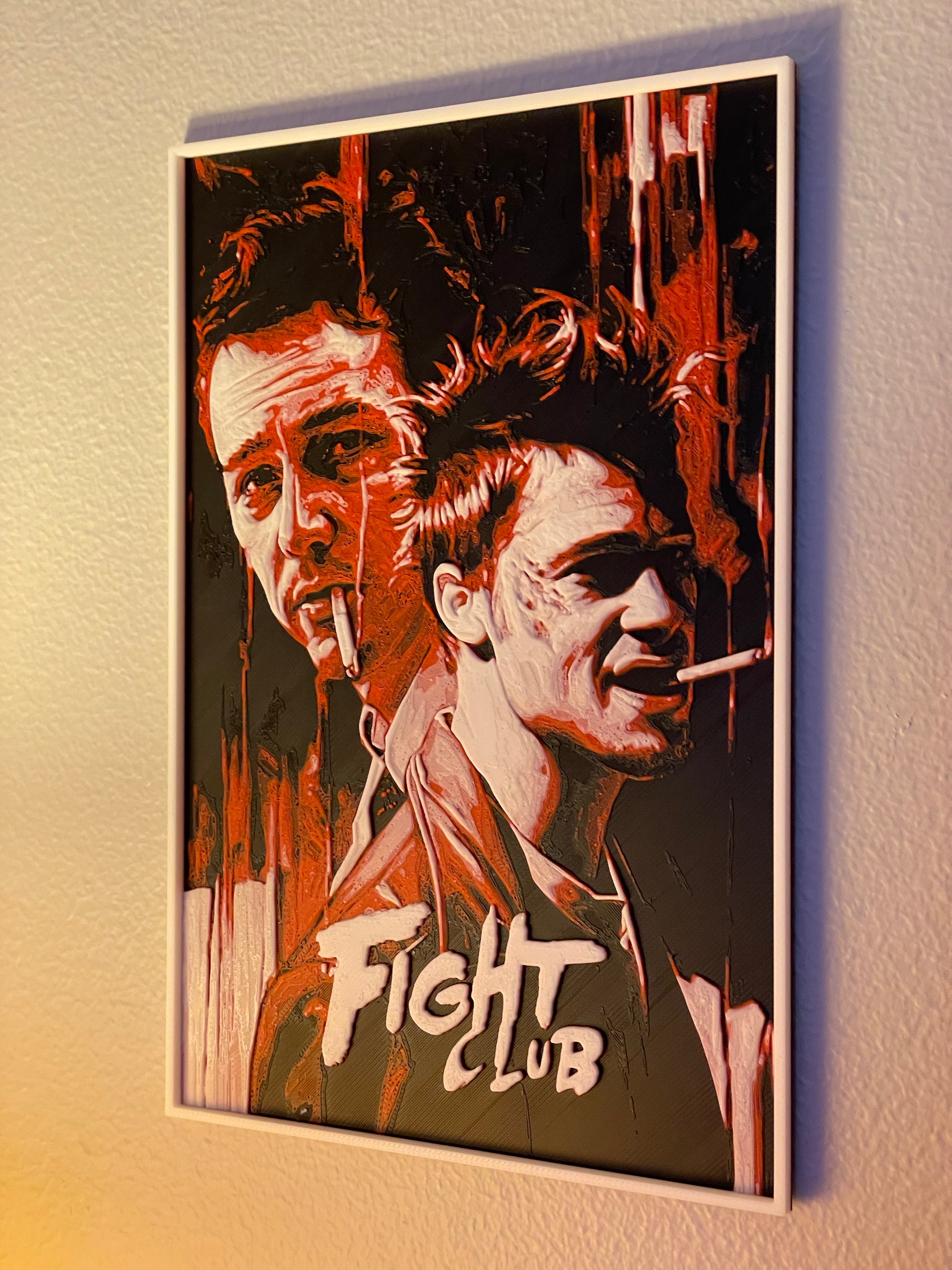 Framed poster of 'Fight Club' with two faces and the movie title.