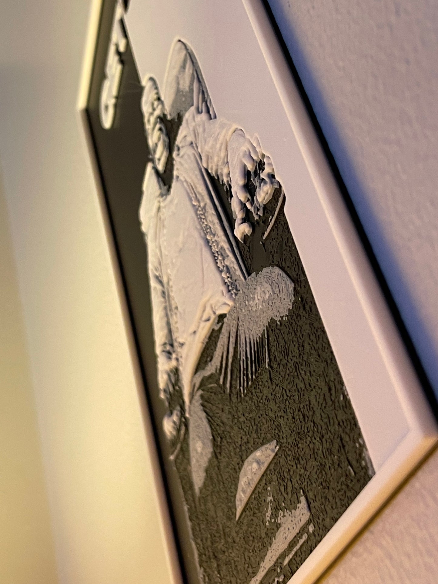 Framed artwork on a textured background