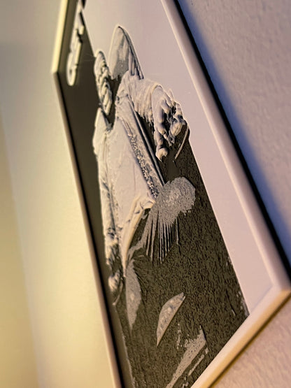 Framed artwork on a textured background