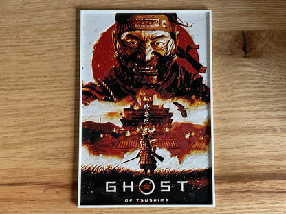 Poster of 'Ghost of Tsushima' game on a wooden surface