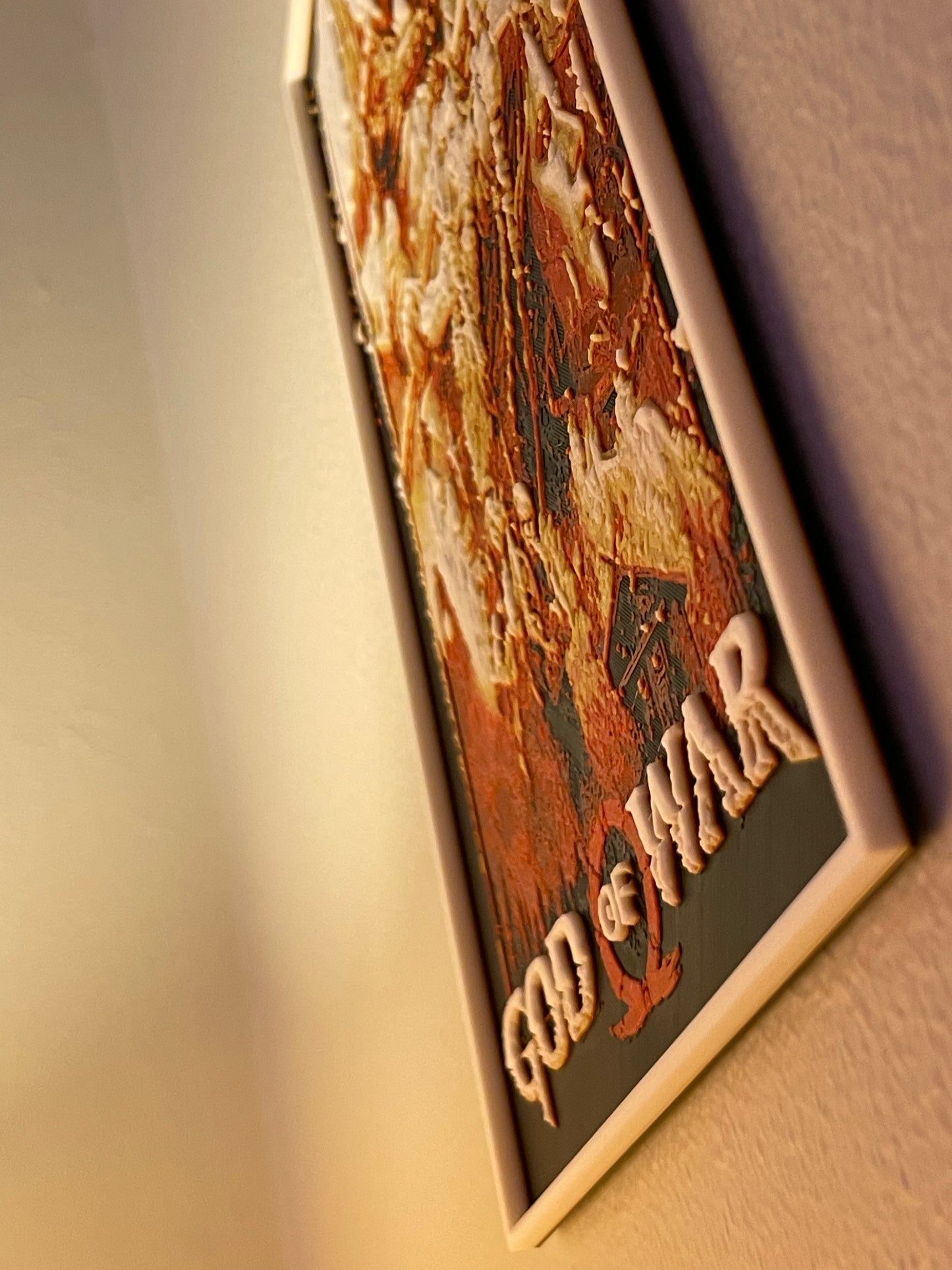Decorative plaque with 'God of War' text on a plain background
