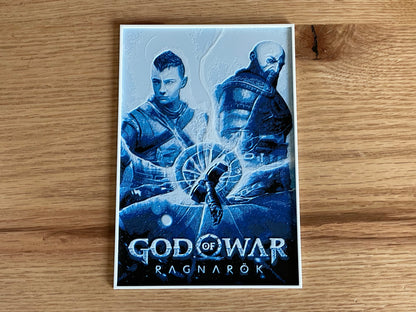 God of War Ragnarök game case on a wooden surface