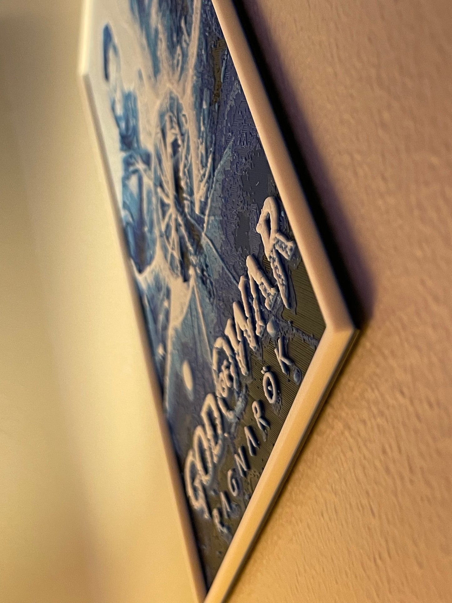 Close-up of a poster with 'God of war' branding.