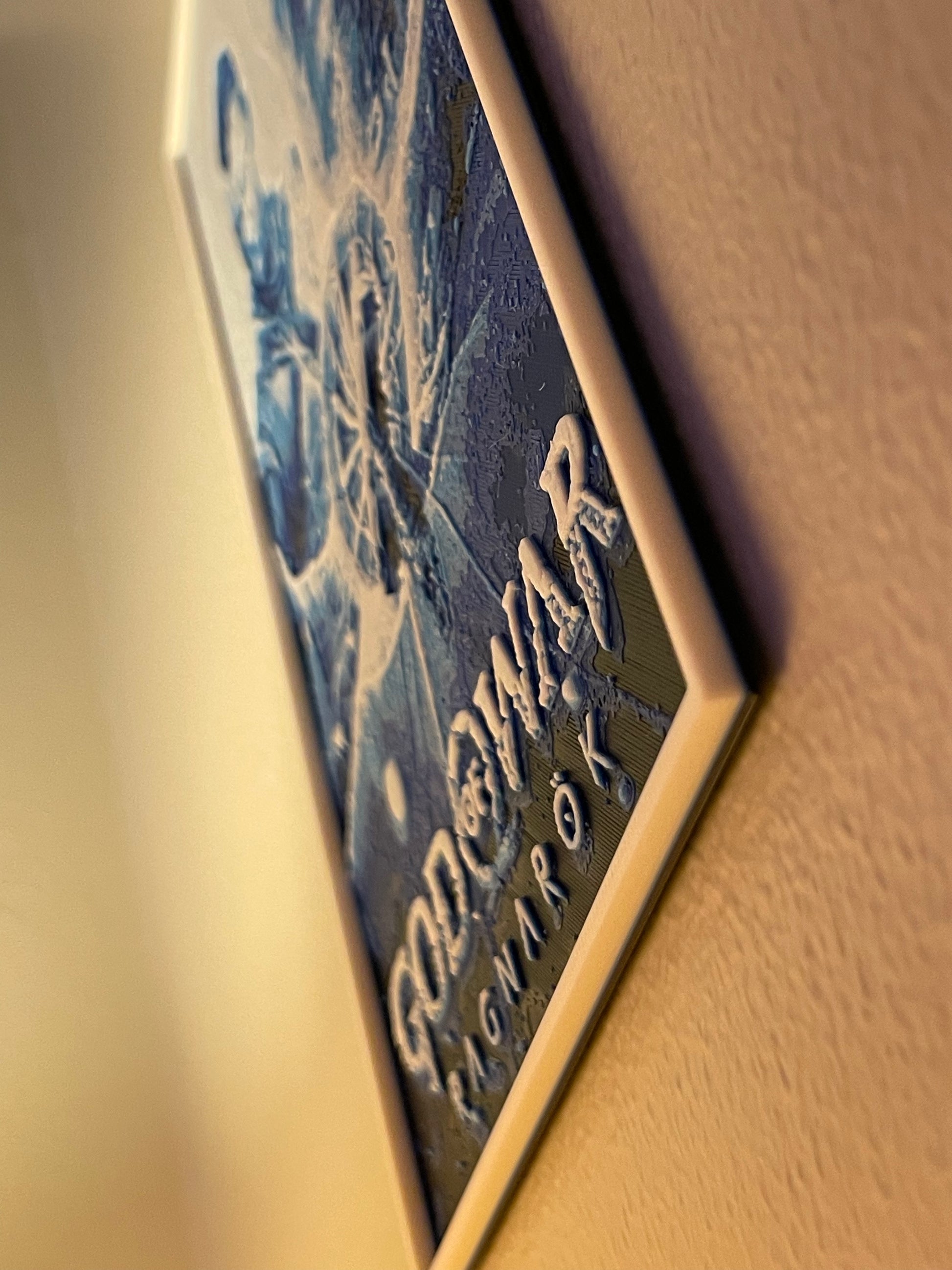 Close-up of a poster with 'God of war' branding.