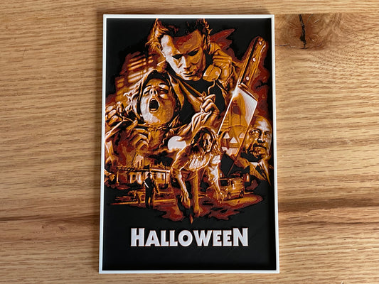 Movie poster for 'Halloween' featuring a wooden carving and text on a wooden surface