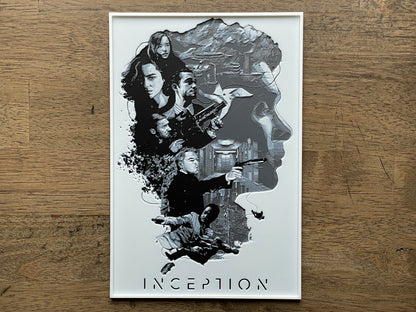 Movie poster for 'Inception' on a wooden surface