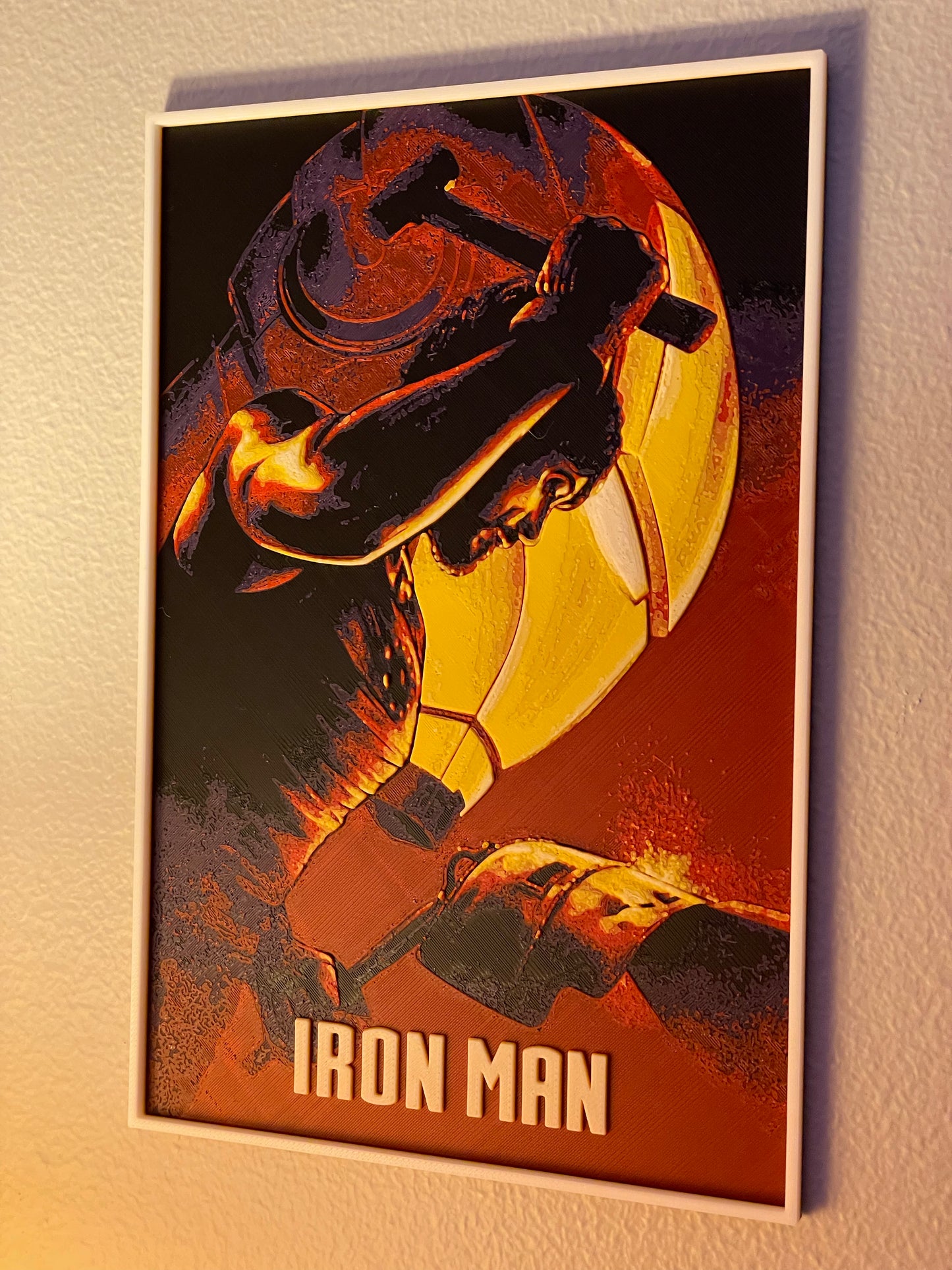 Framed poster of Iron Man holding a hammer on a dark background