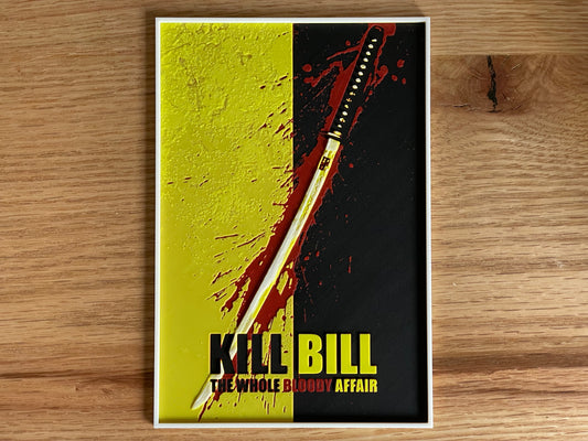 Poster of 'Kill Bill' with a sword on a wooden surface