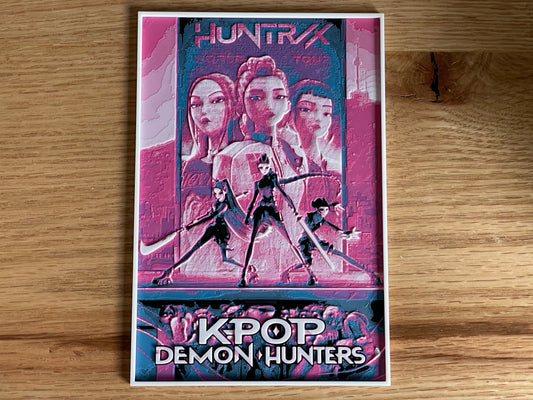 Poster of 'KPOP Demon Hunters' with stylized characters on a wooden surface