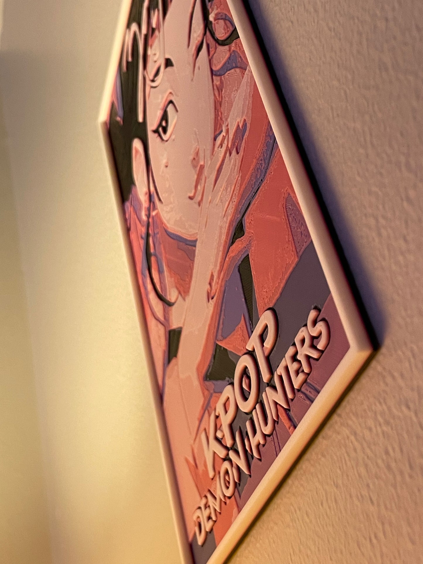Anime-style character on a framed poster with 'KPOP Demon Hunters' text.