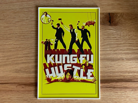 Poster of 'Kung Fu Hustle' on a wooden surface