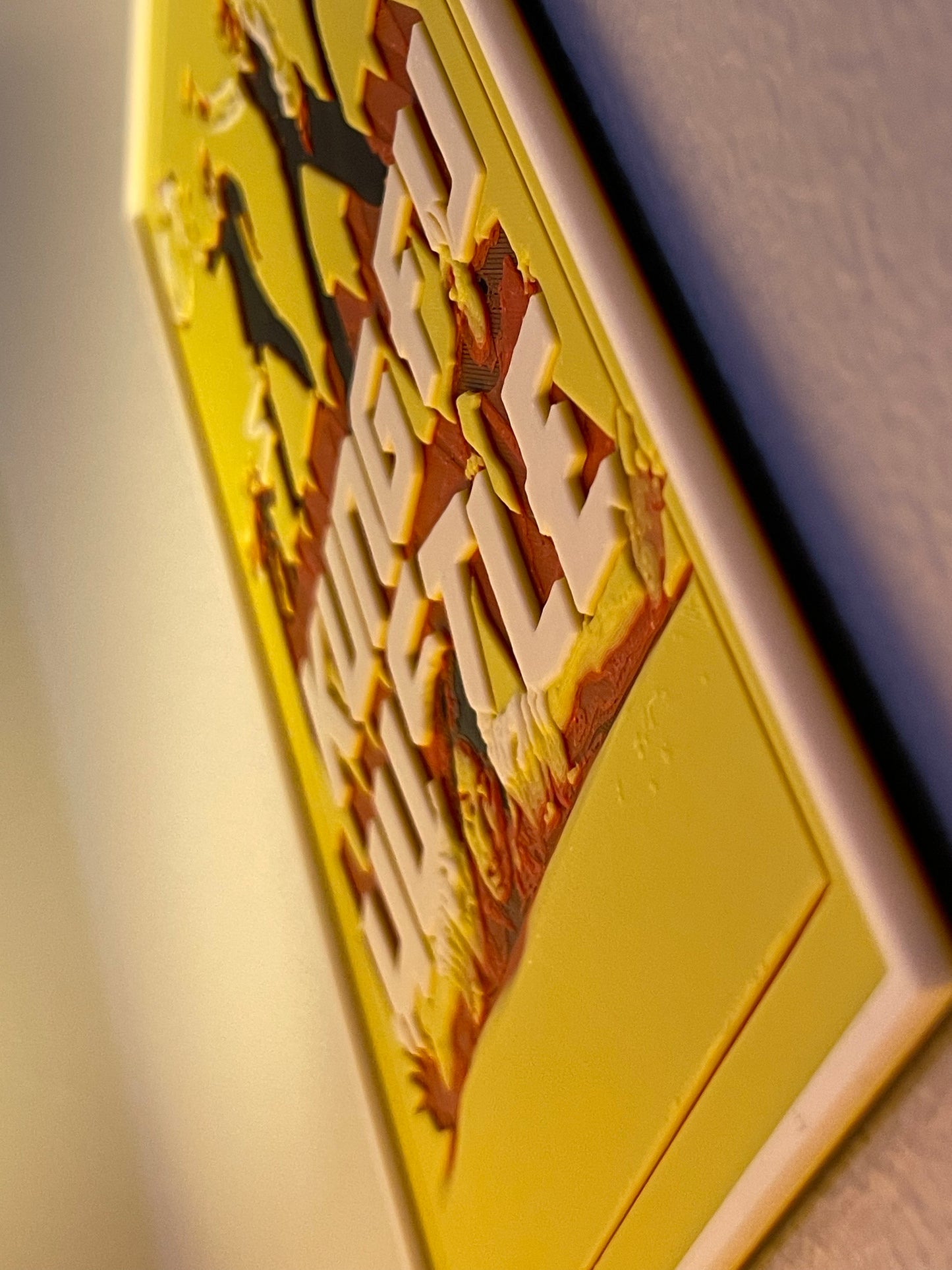 Close-up of a yellow box with text and graphics on a neutral background