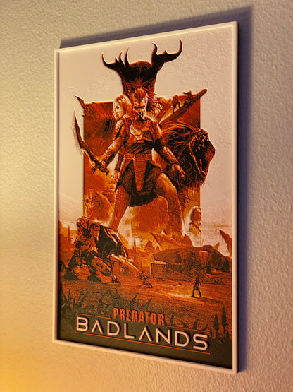 Poster of 'Predator Badlands' with a fantasy scene on a textured wall.