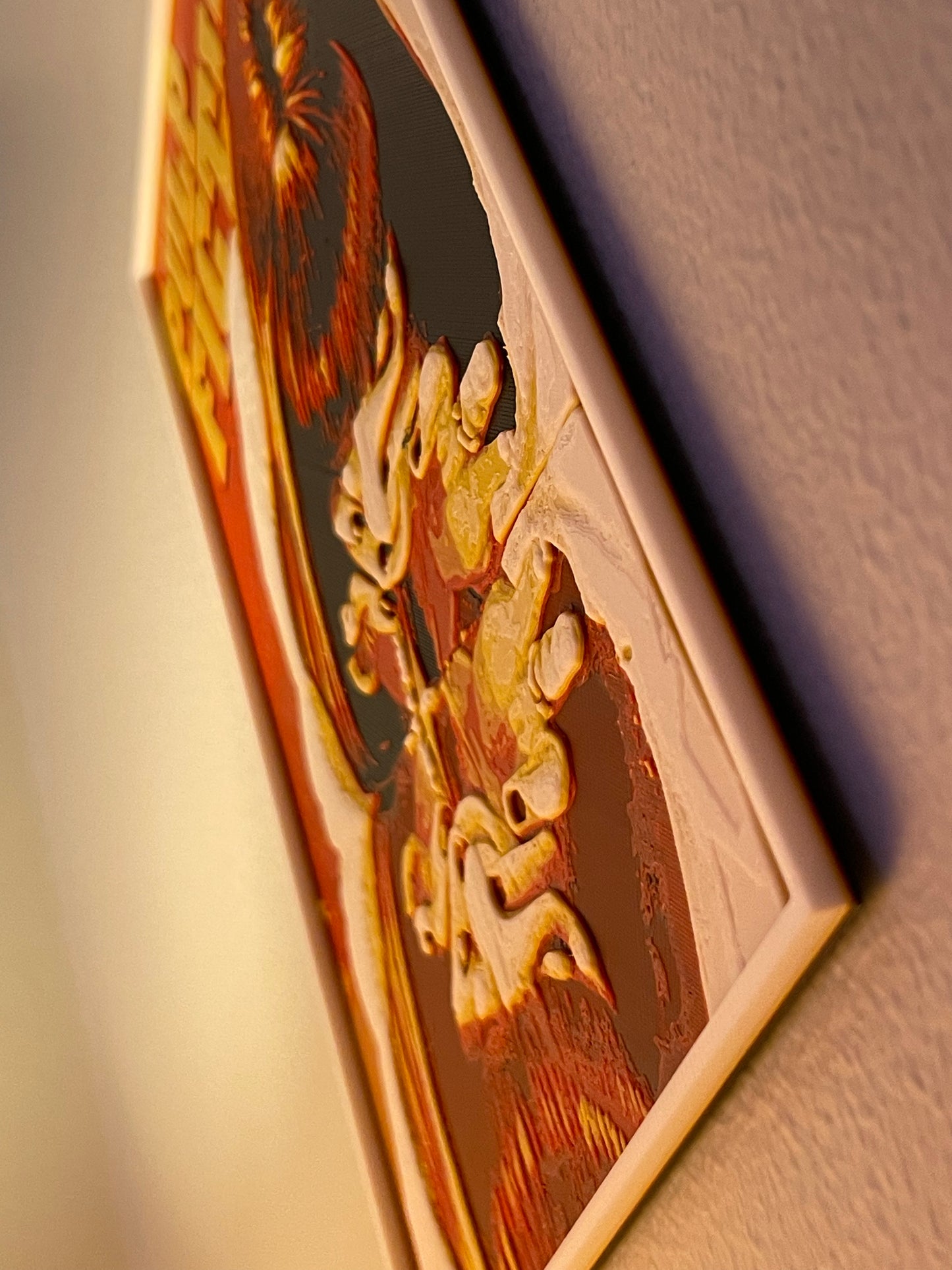 Decorative plaque with intricate designs on a plain background