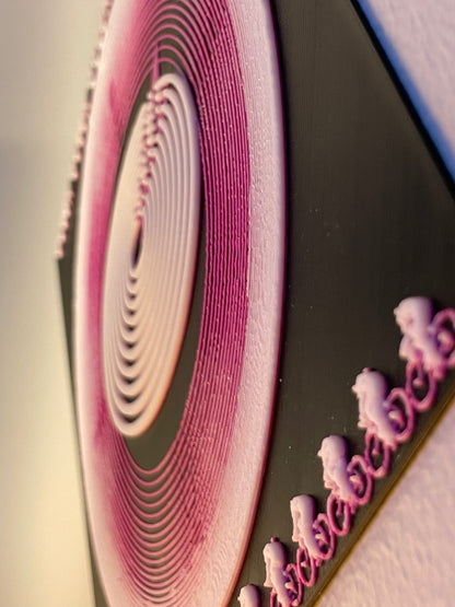 Close-up of a pink and white circular pattern on a black background