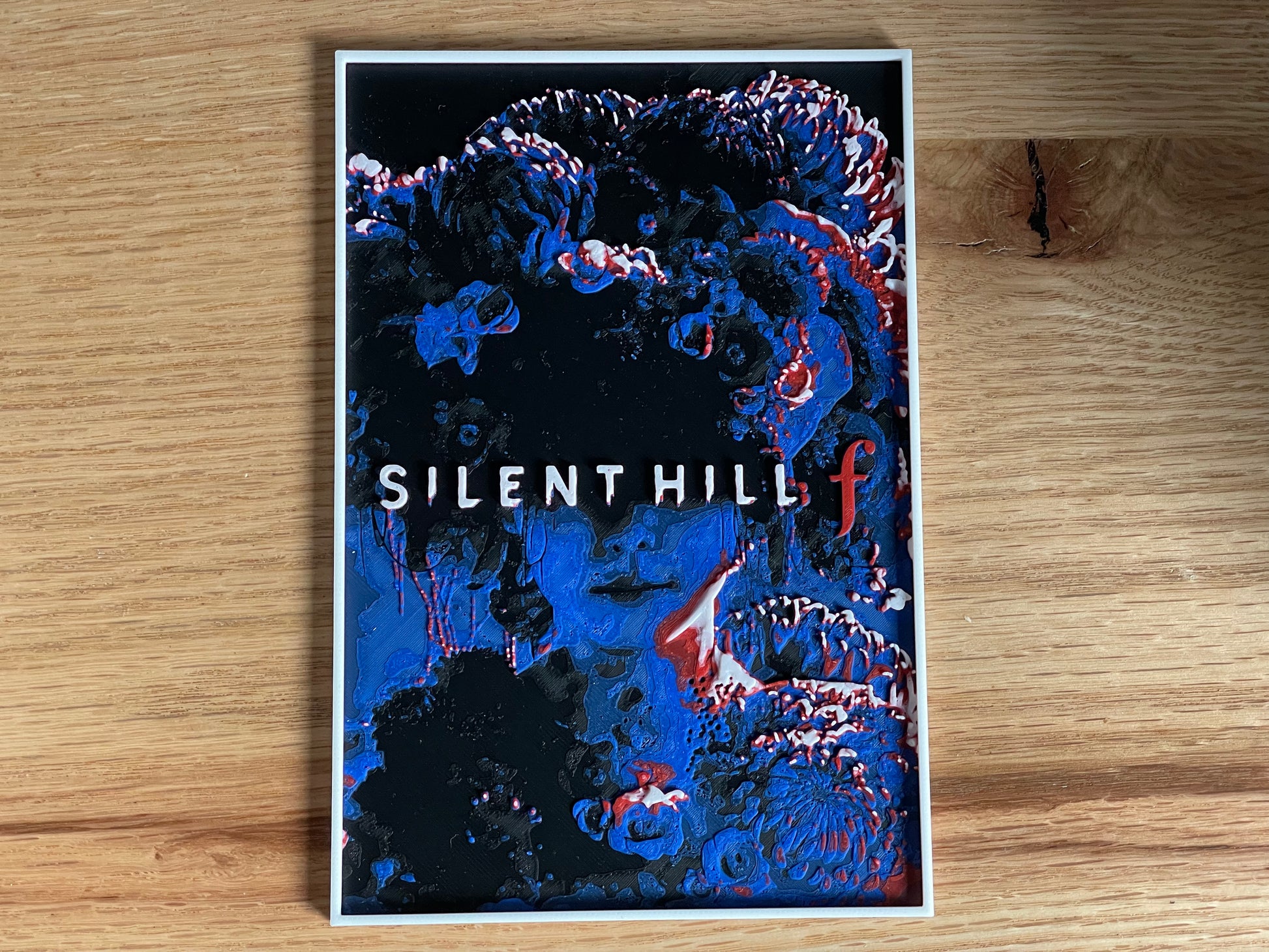 Silent Hill poster on a wooden surface