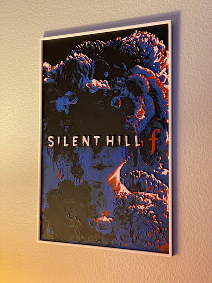 Framed 'Silent Hill' poster on a wall