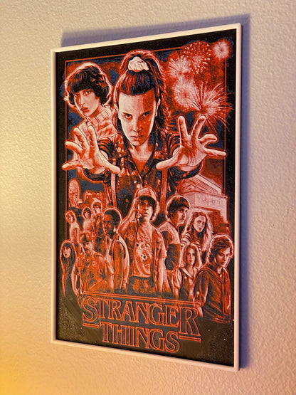 Framed 'Stranger Things' poster on a wall