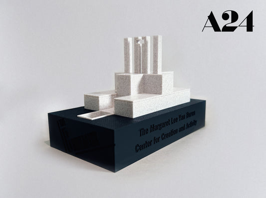 Three-tiered white sculpture on a black base with 'A24' branding on a light gray background