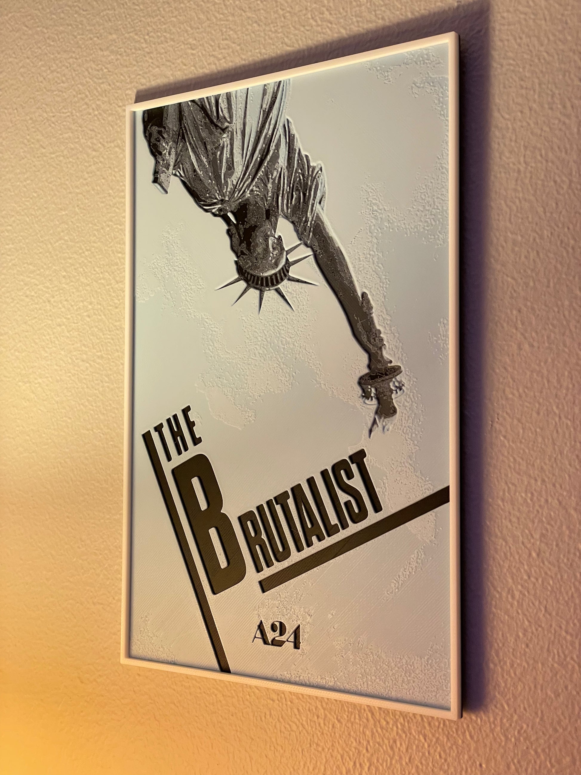Poster of 'The Brutalist' with a stylized figure and 'A24' logo on a beige background