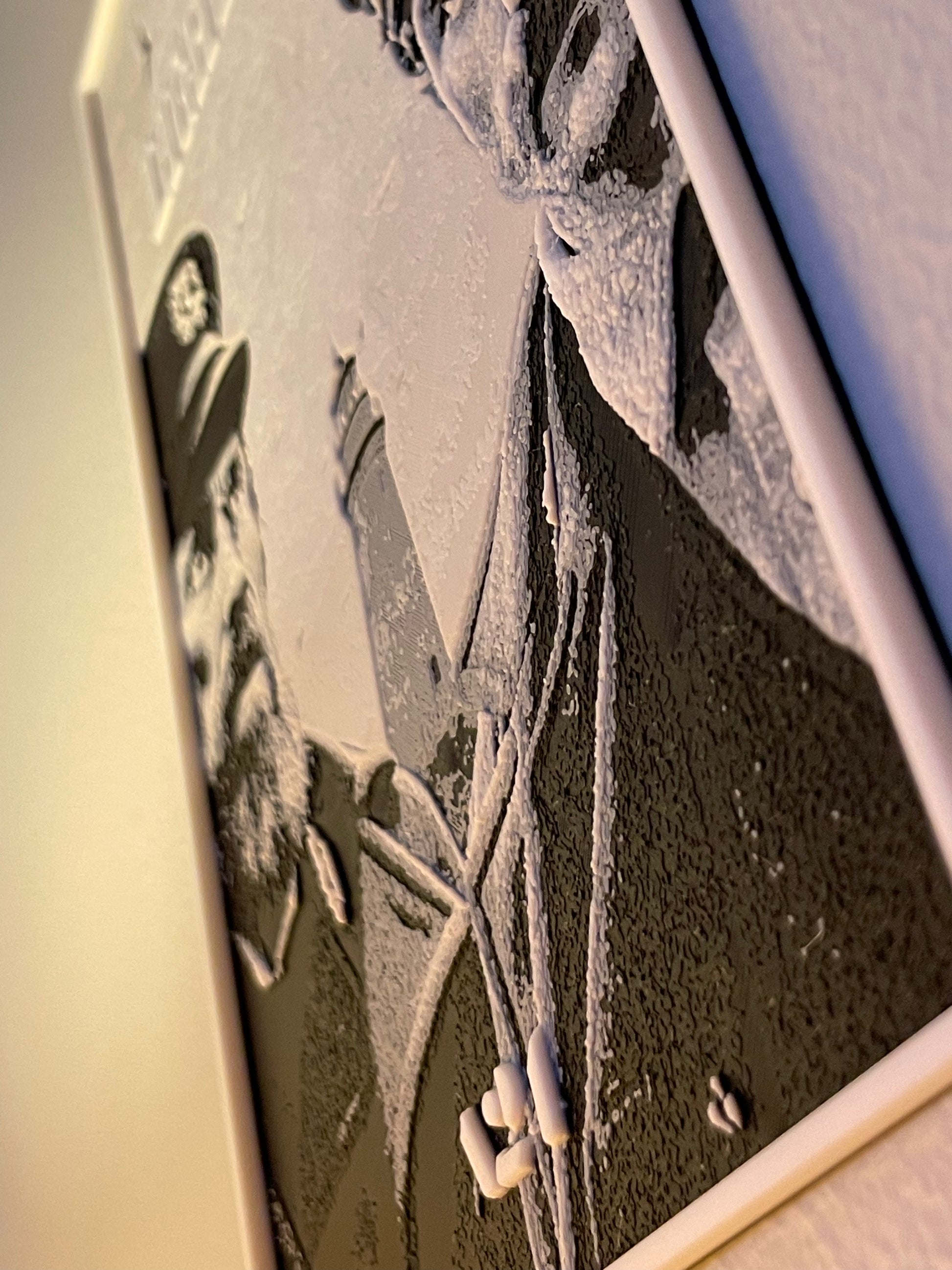 Close-up of a textured surface with a person's silhouette and a blurred object in the foreground.