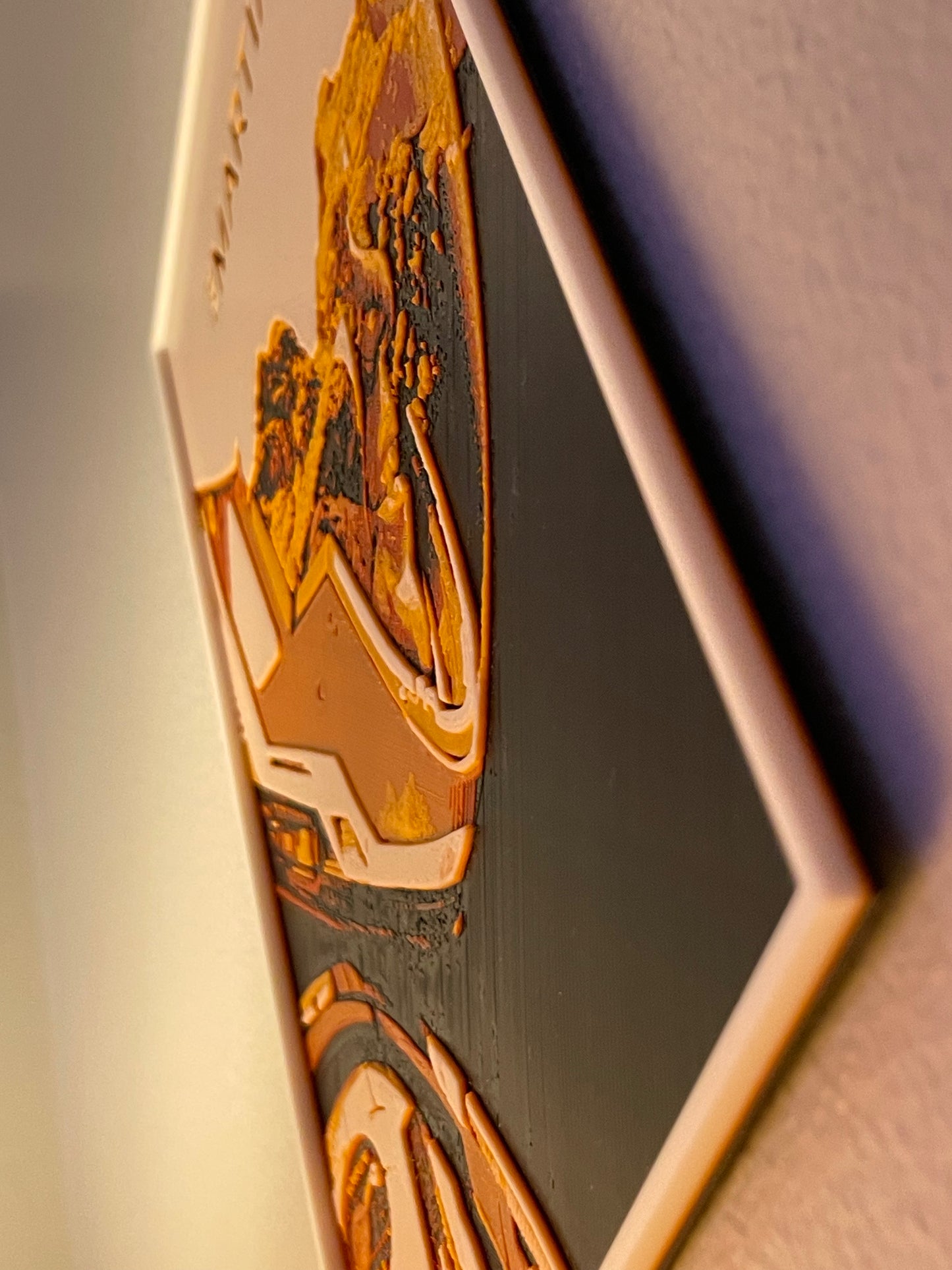 Close-up of a decorative item with intricate designs on a plain background