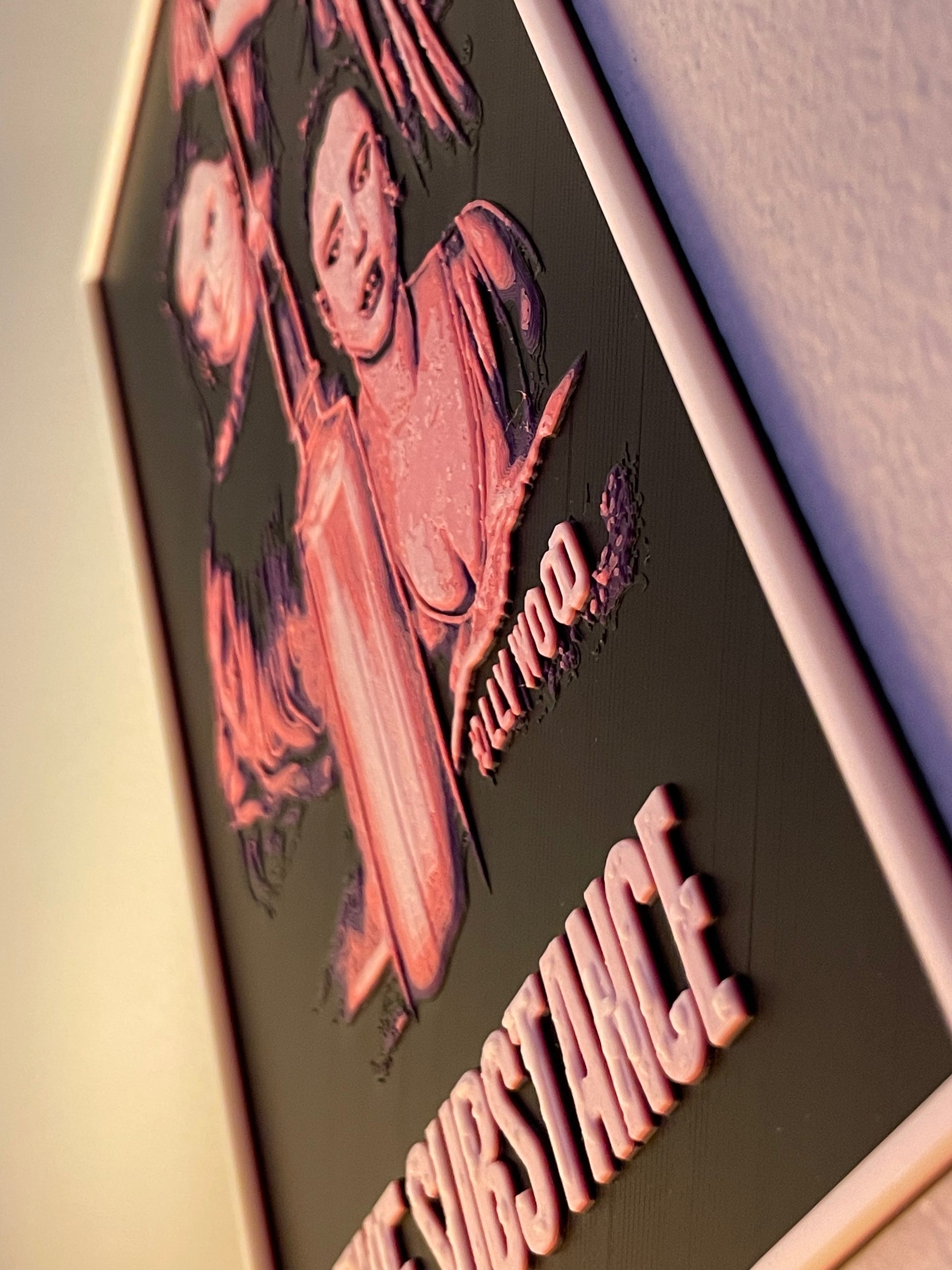 Decorative wall art with a stylized illustration on a dark background.