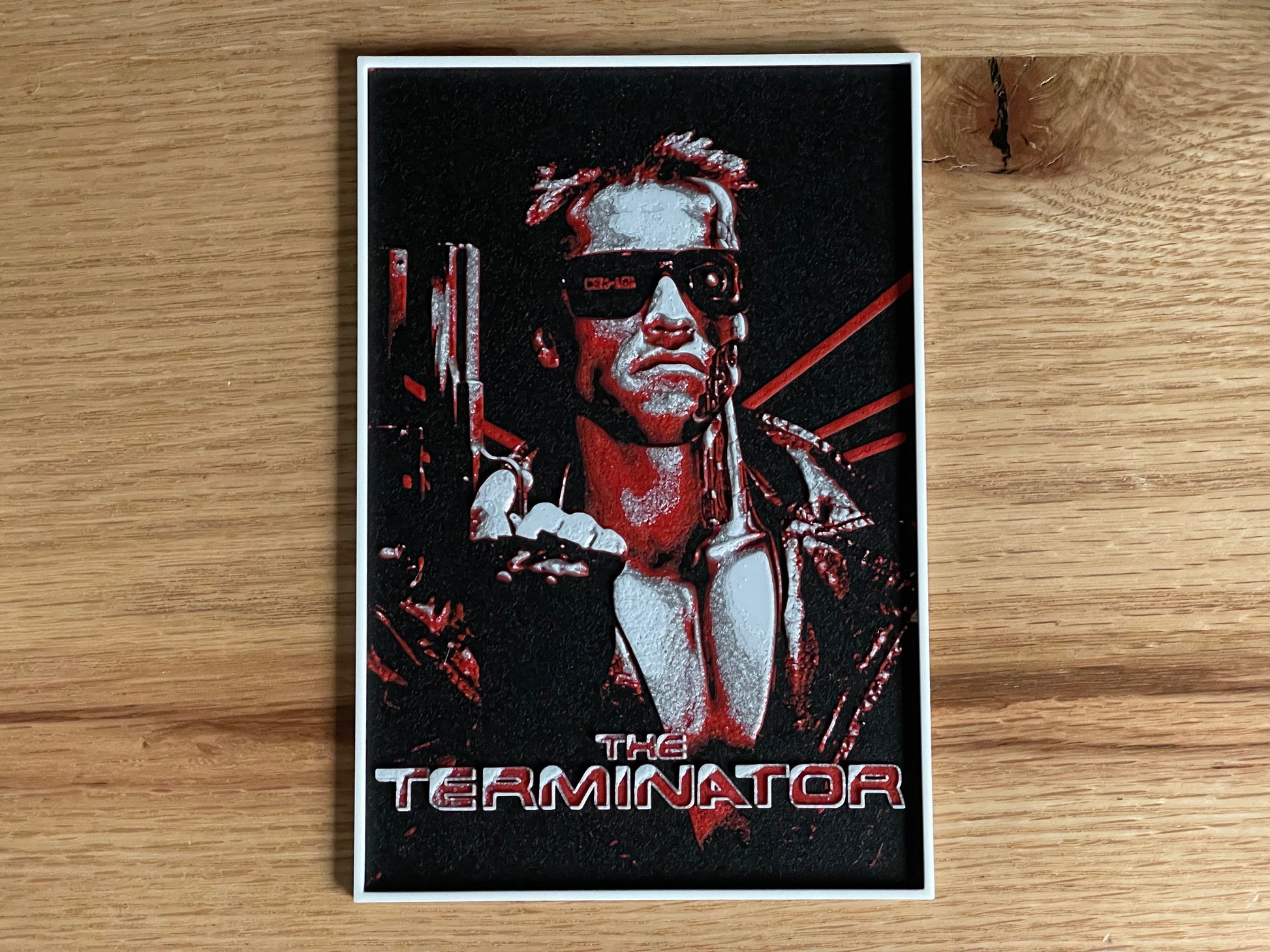 Poster of 'The Terminator' on a wooden surface