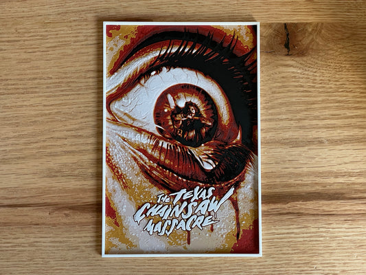 Poster of an eye with a stylized design on a wooden surface