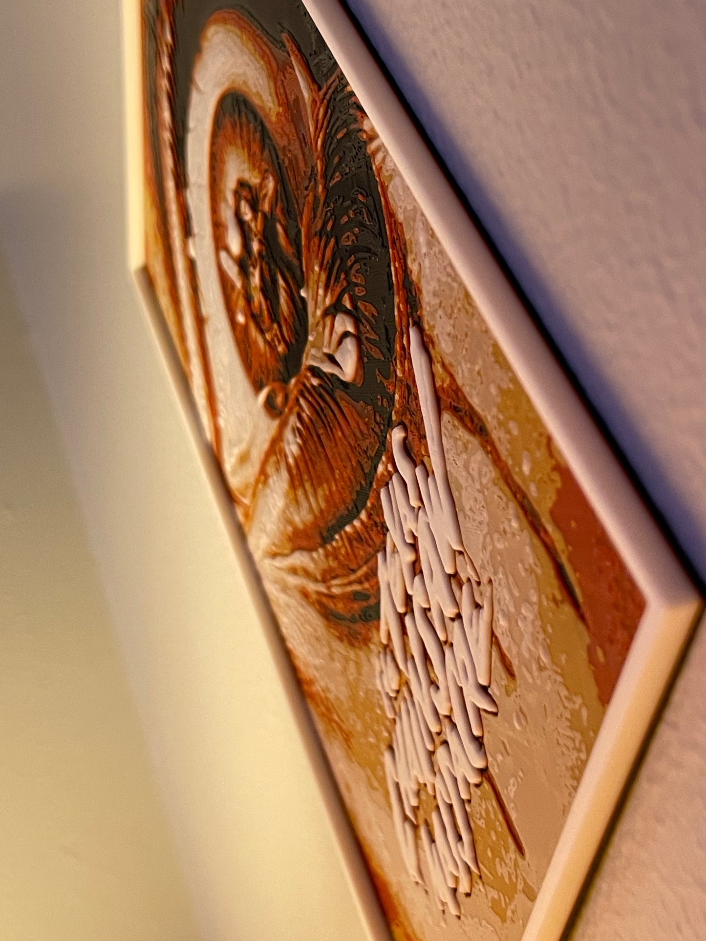 Close-up of a wooden plaque with engraved text and design on a white background