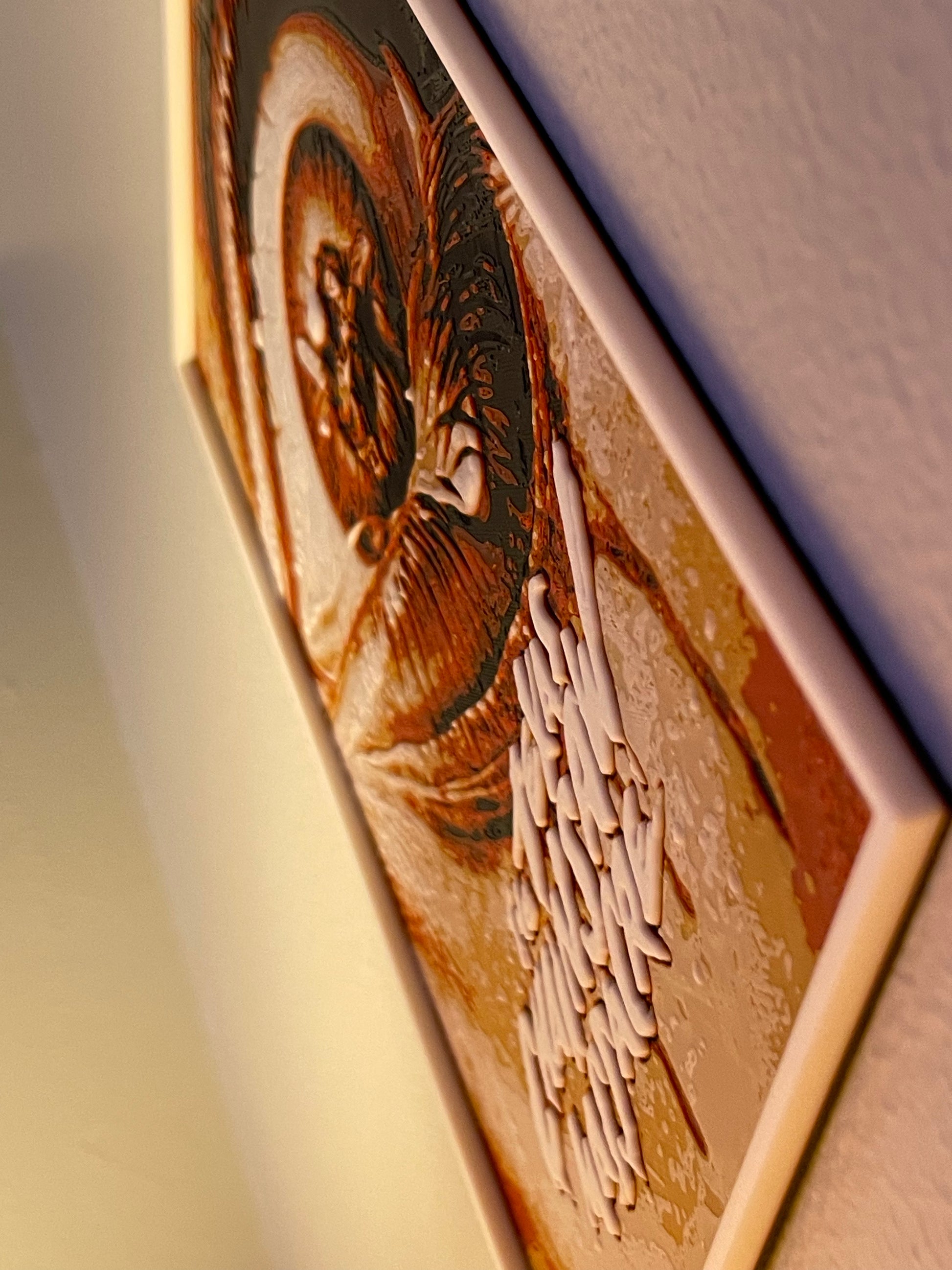 Close-up of a wooden plaque with engraved text and design on a white background